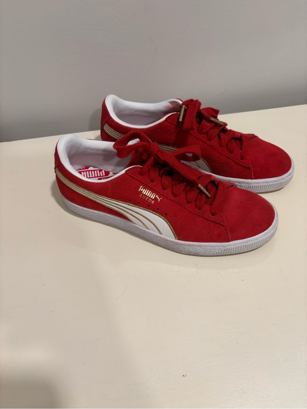 Puma Womens Red Suede Sneakers with Gold Accents
